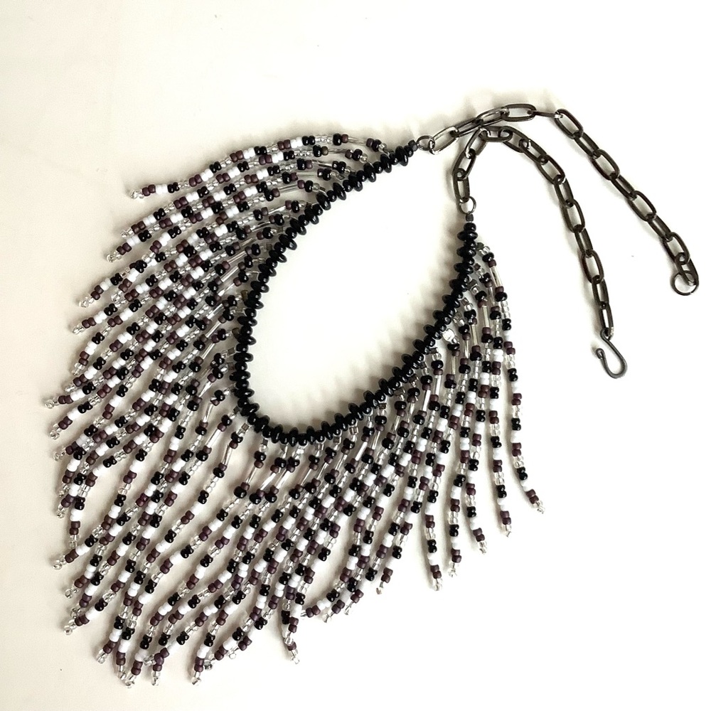 Beaded fringed waterfall necklace in black, white and silver with onyx stones.